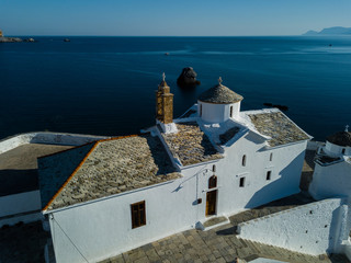 Aerial Image of Architecture of the Greek Islands in the Aegean Sea - Sunrise at Christian Orthodox White Church at Skopelos, Northern Sporades - Panagitsa Tou Pirgou - Drone Image
