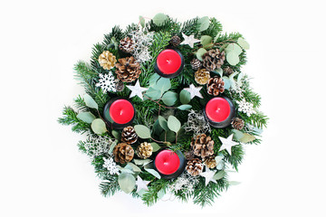 Christmas advent wreath isolated on white table background. Decorated by evergreen fir tree...