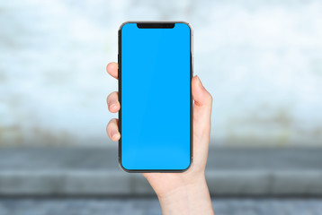 Woman hand holding modern smatphone mockup on white