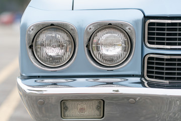 Close up of vintage blue car bumber and lamps