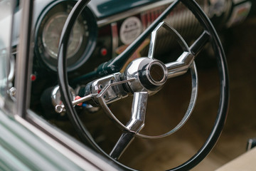 Close up of driver's wheel of vintage car