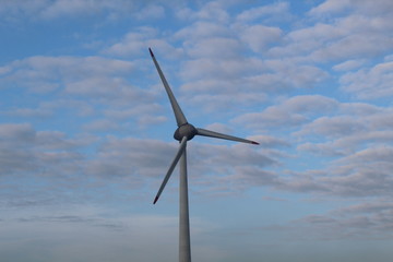 Windmill in front of a hazy autumn sky 