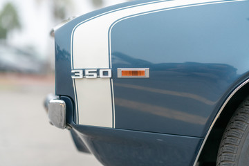 Close up of vintage car with 350 plaque