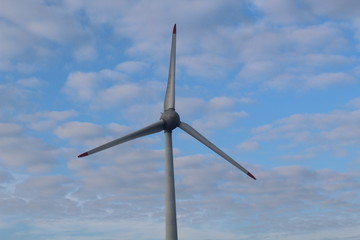 Windmill in front of a hazy autumn sky 