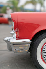 Close up of vintage red car bumber and lamps