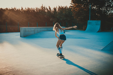 Beautiful skater girl lifestyle moments in a skatepark © oneinchpunch