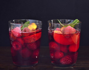 Lemonade with raspberries, peaches and mint