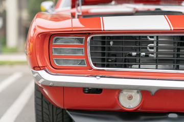 Close up of vintage red car bumber and lamps