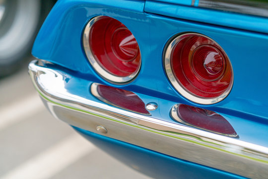 Close up of vintage blue car bumper and rear lamps