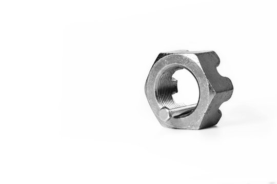 Small nut and a large bolt on white background, wrong tool for the job idea, put the right man on the right job concept