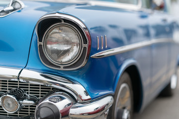 Close up of vintage blue car bumber and lamps