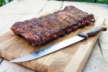 St Louis style grilled pork ribs on cutting board