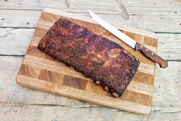 St Louis style grilled pork ribs on cutting board