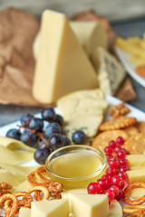 cheese platter on a plate with berries