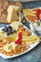 cheese platter on a plate with berries