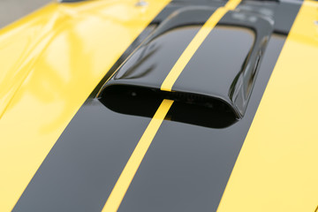 Close up of yellow vintage car air vents