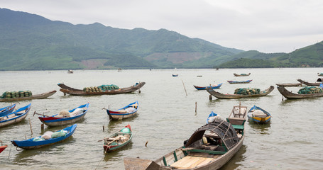 small wood fishing boats on river in Vietnam