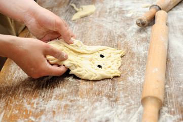 Young children make dough products. Hands closeup
