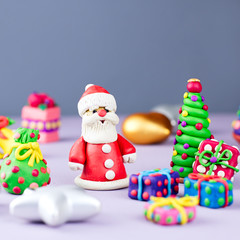 Christmas background with decorations. Santa, Christmas train with tree and sweets, snowman, reindeer and gifts