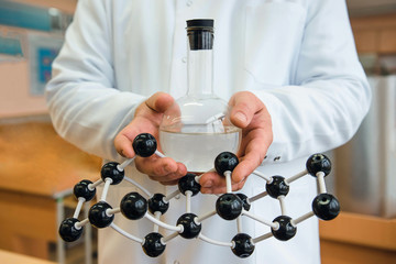 Flask with molecule in hand
