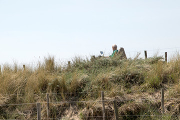 Obraz premium People walking in the dunes