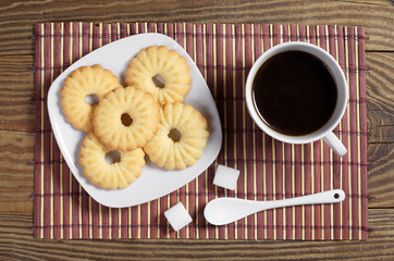 Cup of coffee and sweet cookies