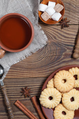 Tea, cookies, spice and sugar on table
