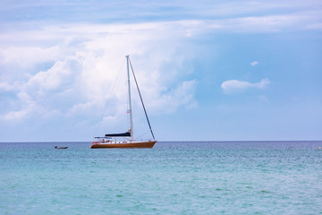Fototapeta premium Sailing ship luxury yacht with white sails in the Sea.