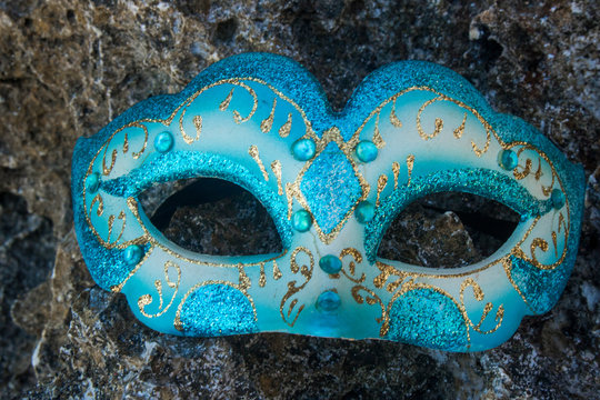masquerade party mask on beach view