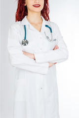  Female doctor with red hair. Isolated white background. stethoscope file and white uniform