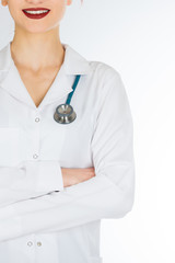  Female doctor with red hair. Isolated white background. stethoscope file and white uniform