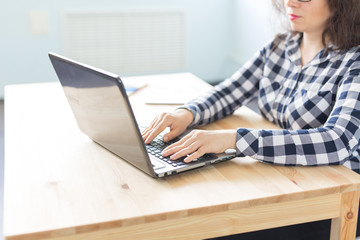 Fototapeta premium Technology, business and people concept - Close up of woman's hand typing on keyboard