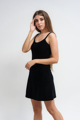 Studio portrait of a smiling happy beautiful brunette girl on white background.