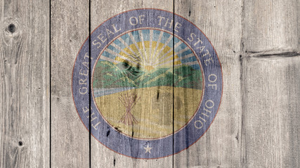 USA Politics News Concept: US State Ohio Seal Wooden Fence Background