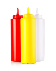  three plastic sauce bottles  isolated on a white