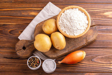 Fototapeta na wymiar Ingredients for traditional potato pancakes or latke Hanukkah celebration