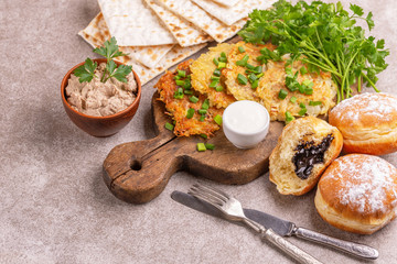Tasty Hanukkah celebration food on vintage cutting board