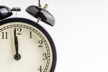 Clock isolated on white background with selective focus and crop fragment