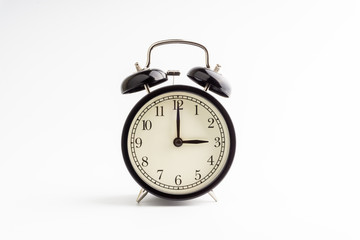 Clock isolated on white background with selective focus and crop fragment