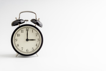 Clock isolated on white background with selective focus and crop fragment