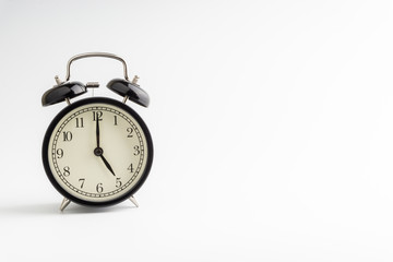 Clock isolated on white background with selective focus and crop fragment