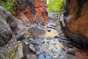 Kanarraville Falls, views from along the hiking trail of falls, stream, river, sandstone cliff formations Waterfall in Kanarra Creek Canyon by Zion National Park, Utah, USA.