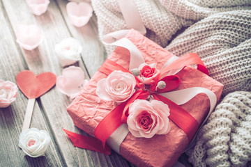 Beautiful red gift box on wooden background