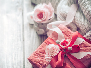 Beautiful red gift box on wooden background