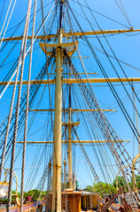 Sails and mast  against a blue sky