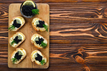 Toastes with black caviar. Spase for text or design.