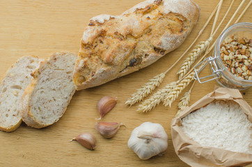 Homemade garlic nut bread on a wooden background
