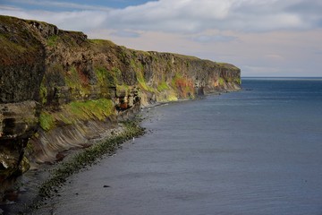 Icelandic landscape. Colorful cliffs on the west coast of peninsula Skagi.