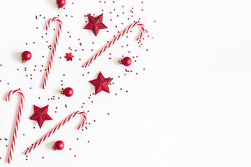 Christmas composition. Red decorations on white background. Christmas, winter, new year concept. Flat lay, top view, copy space