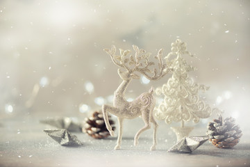 Silver glitter Christmas tree, deer, cones on grey background with lights bokeh, copy space. Greeting card for new year party. Festive holiday concept. Banner